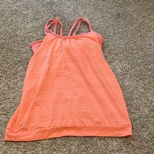 Orange athletic tank top with built in sports bra